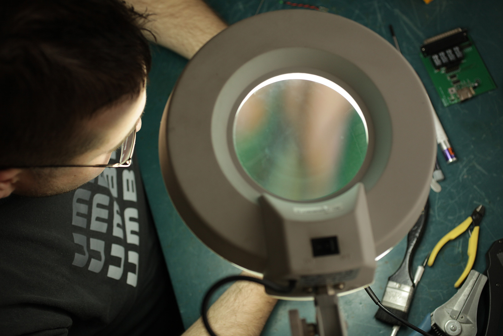 Man working on relay testing equipment
